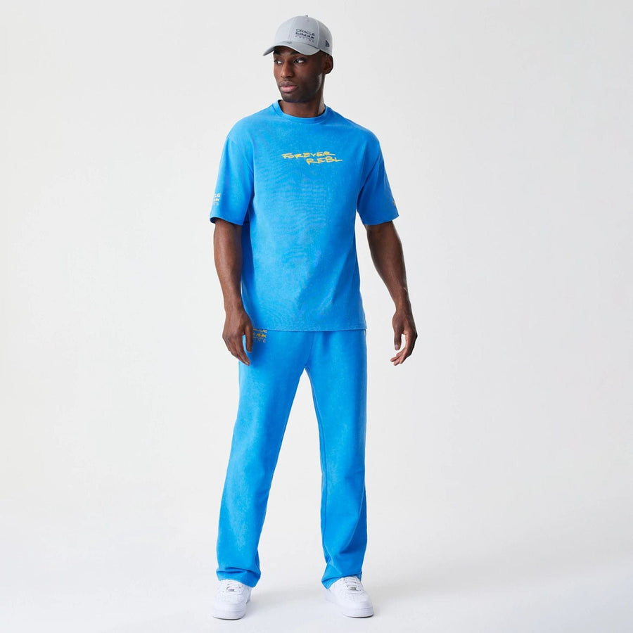 The Male model is wearing Red Bull Racing Back Graphic Blue Oversized T-Shirt 8