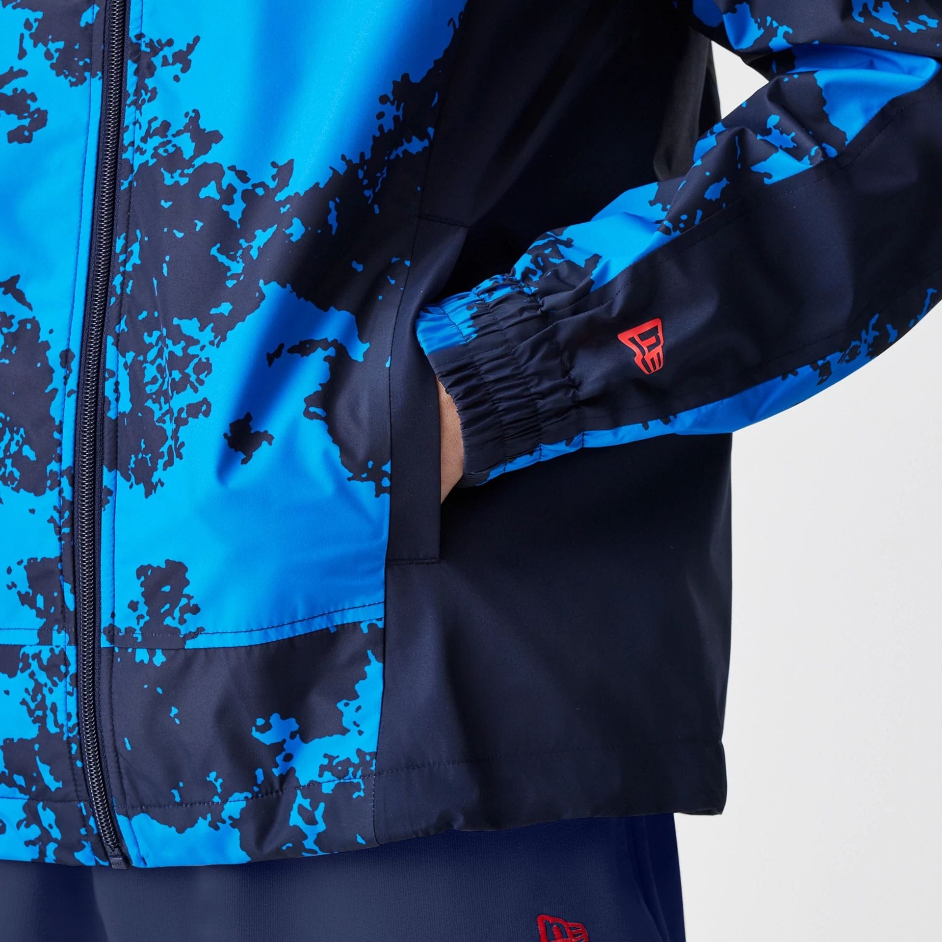 The Male model is wearing Red Bull Racing Blue Windrunner Jacket 6