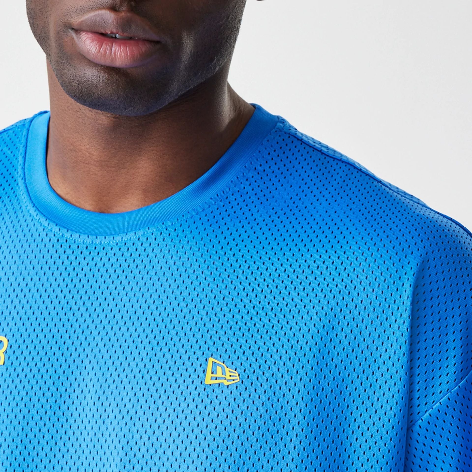 The Male model is wearing Red Bull Racing Graphic Mesh Blue Oversized T-Shirt 7