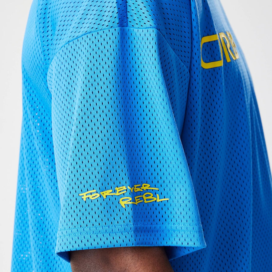 The Male model is wearing Red Bull Racing Graphic Mesh Blue Oversized T-Shirt 4