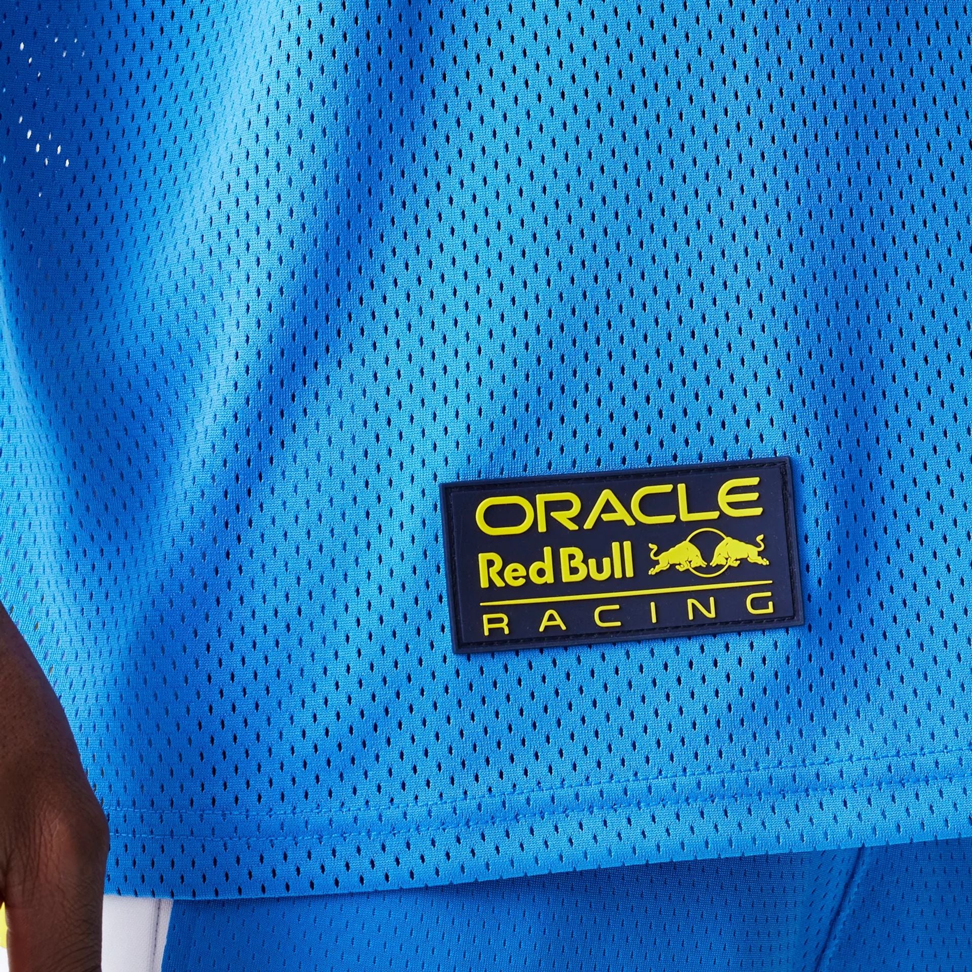 The Male model is wearing Red Bull Racing Graphic Mesh Blue Oversized T-Shirt 5