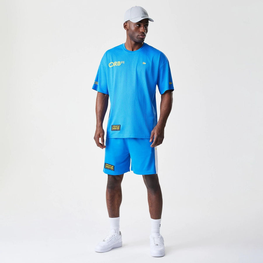 The Male model is wearing Red Bull Racing Graphic Mesh Blue Oversized T-Shirt 8