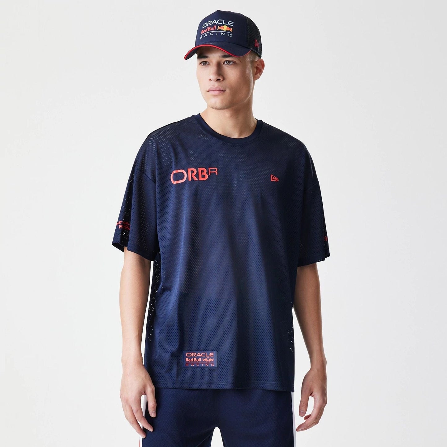 The Male model is wearing Red Bull Racing Graphic Mesh Dark Blue Oversized T-Shirt 1