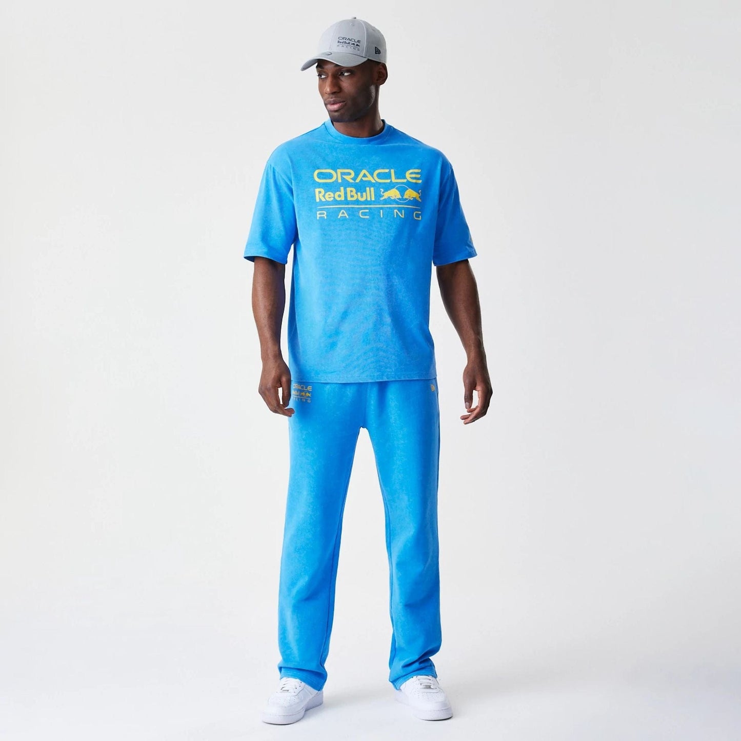 The Male model is wearing Red Bull Racing Blue Joggers 8