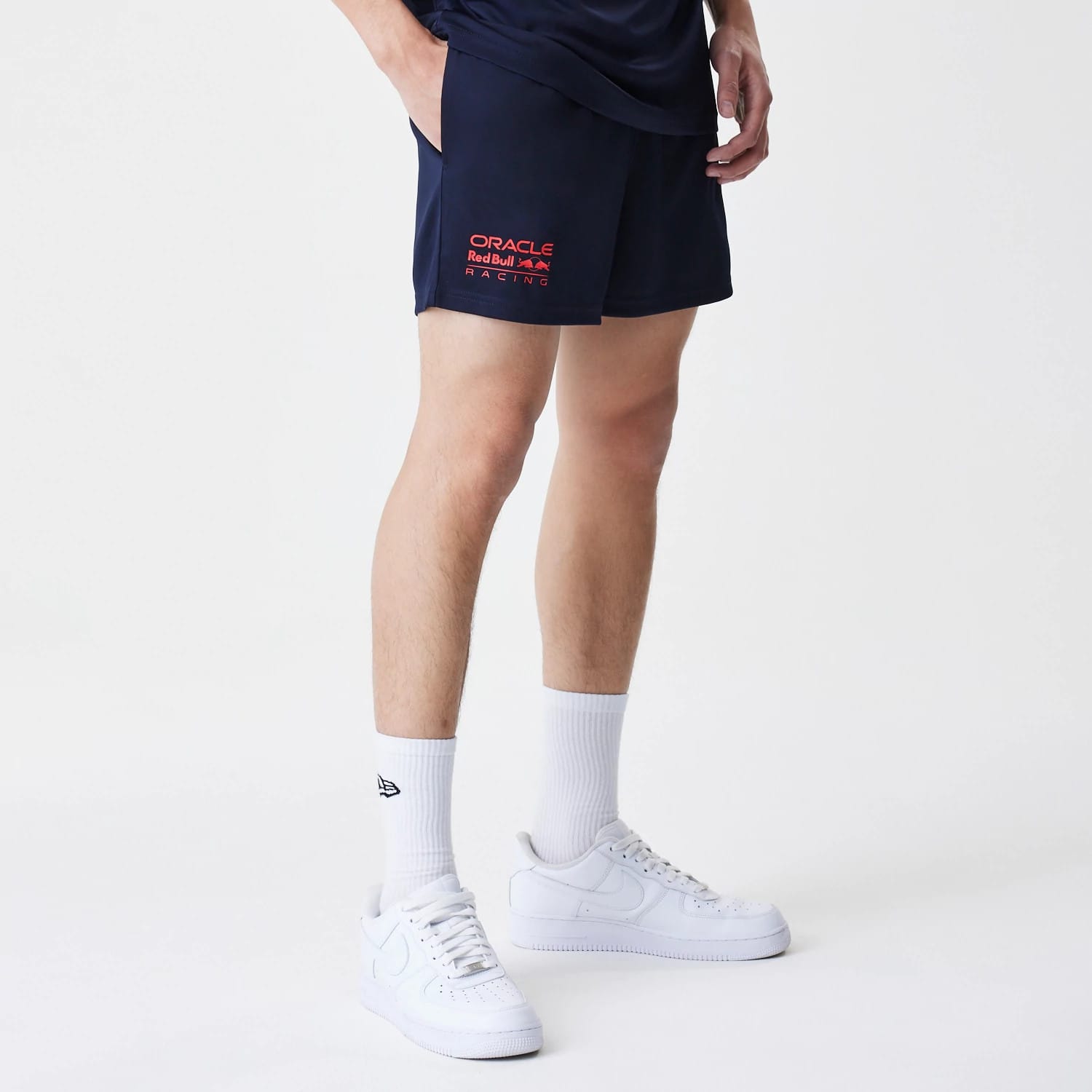 The Male model is wearing Red Bull Racing Graphic Dark Blue Football Shorts 7