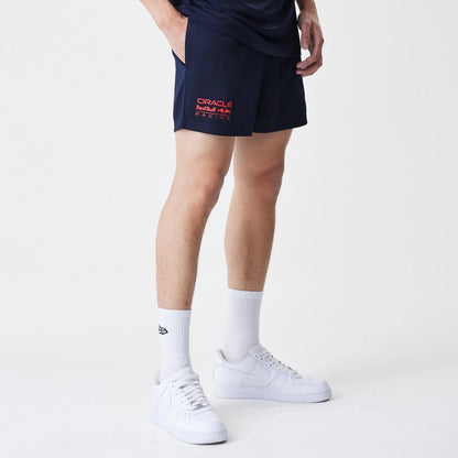 The Male model is wearing Red Bull Racing Graphic Dark Blue Football Shorts 7