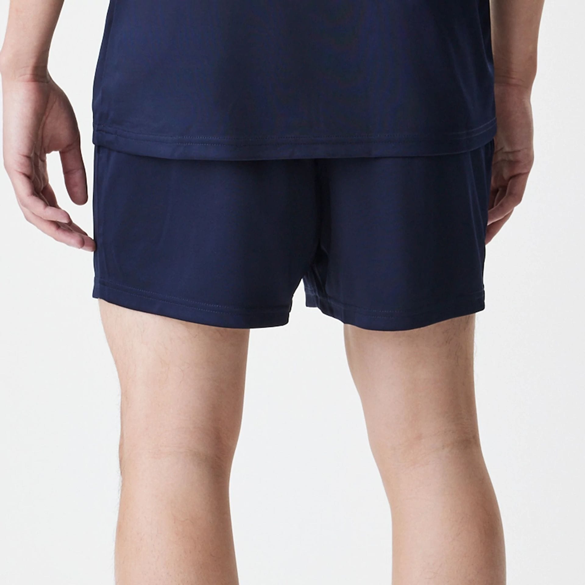 The Male model is wearing Red Bull Racing Graphic Dark Blue Football Shorts 6