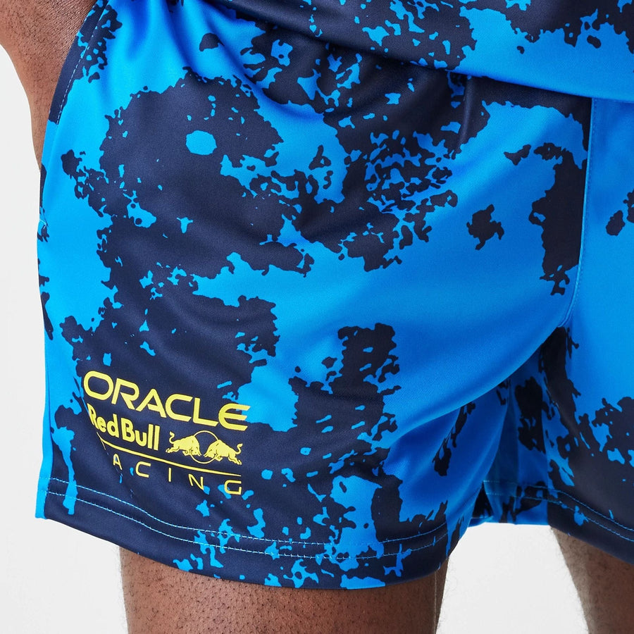 The Male model is wearing Red Bull Racing Graphic Blue Football Shorts 3