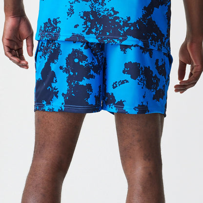 The Male model is wearing Red Bull Racing Graphic Blue Football Shorts 6
