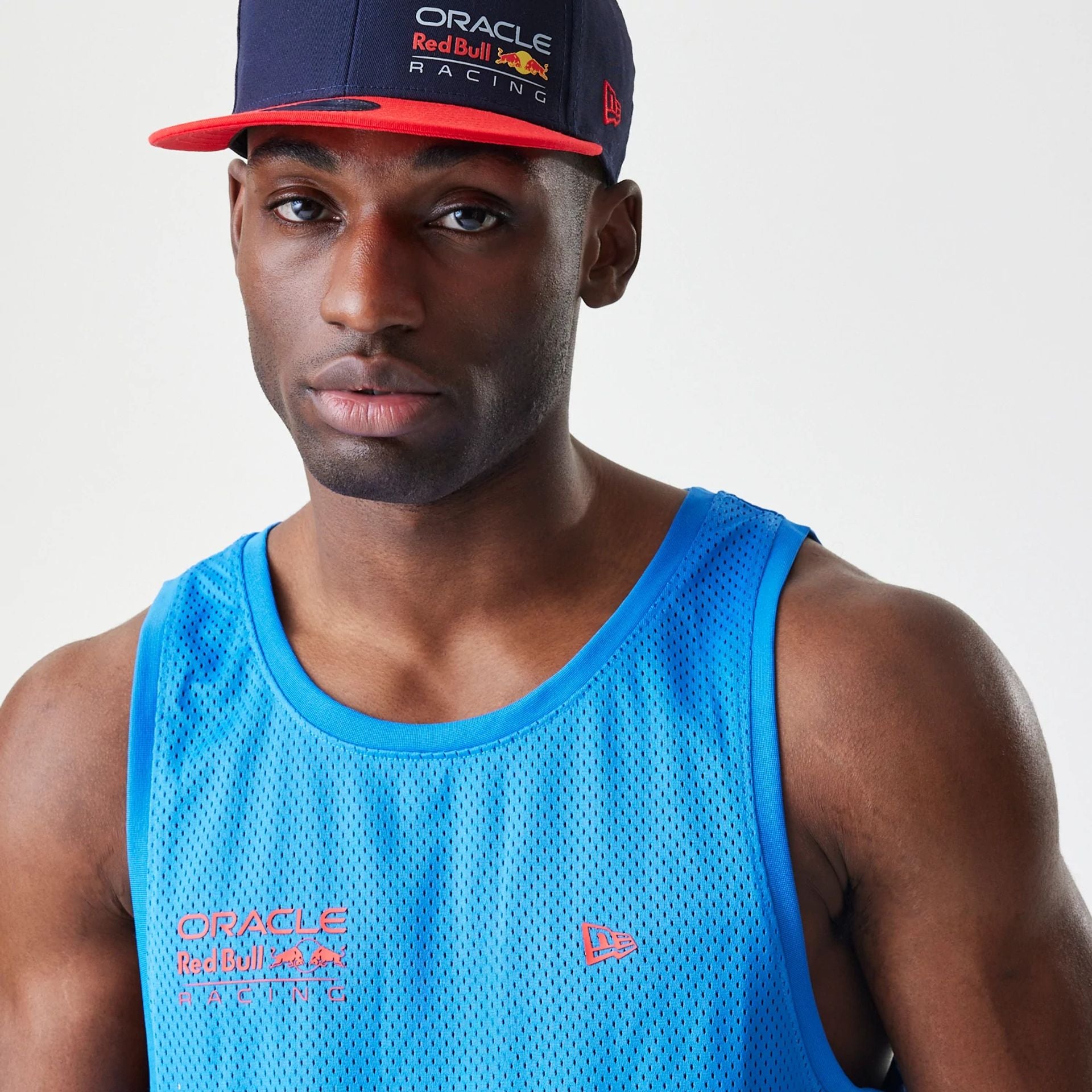 The Male model is wearing Red Bull Racing Basketball Mesh Blue Sleeveless T-Shirt 5