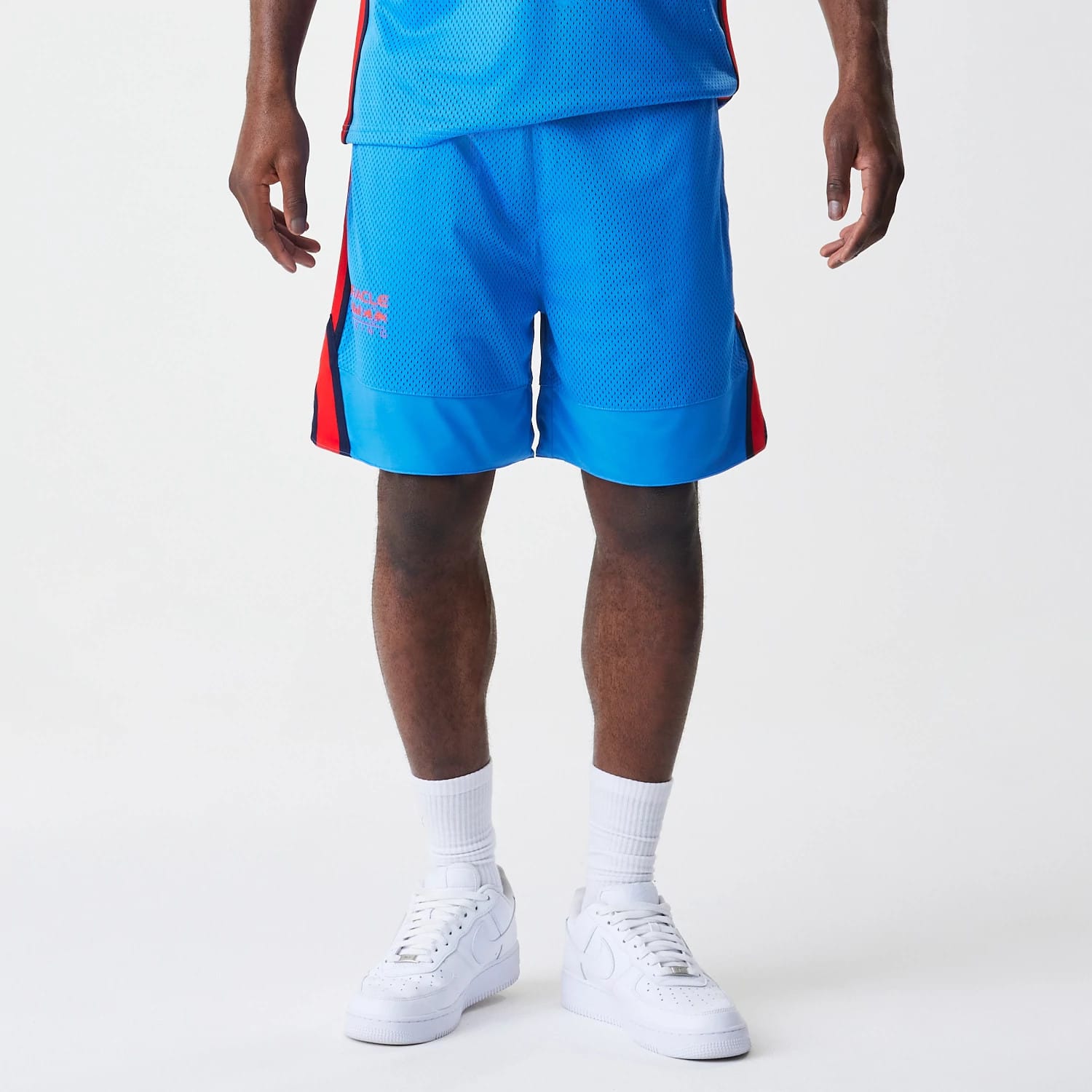 The Male model is wearing Red Bull Racing Basketball Mesh Blue Shorts 7