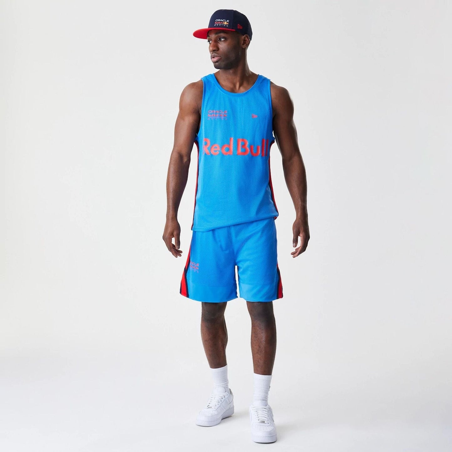 The Male model is wearing Red Bull Racing Basketball Mesh Blue Shorts 6