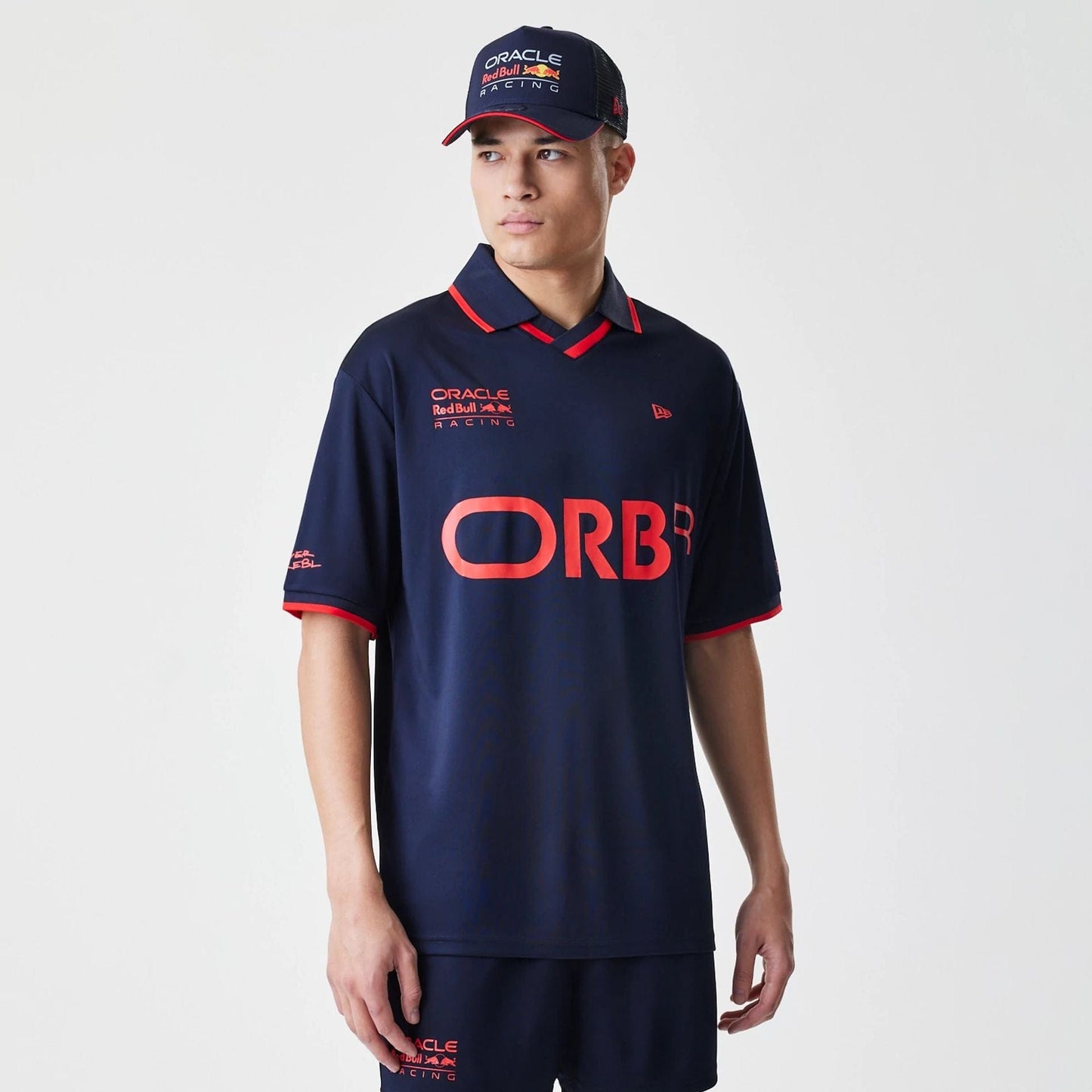 The Male model is wearing Red Bull Racing Graphic Dark Blue Football Jersey 1