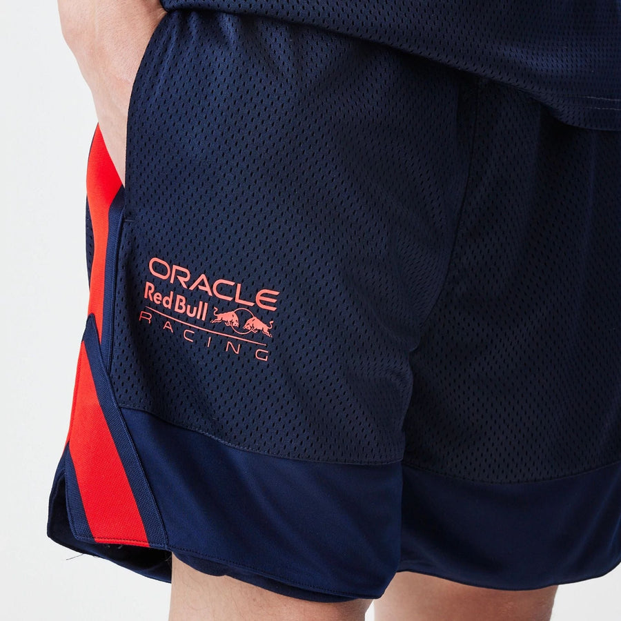 The Male model is wearing Red Bull Racing Basketball Mesh Dark Blue Shorts 3