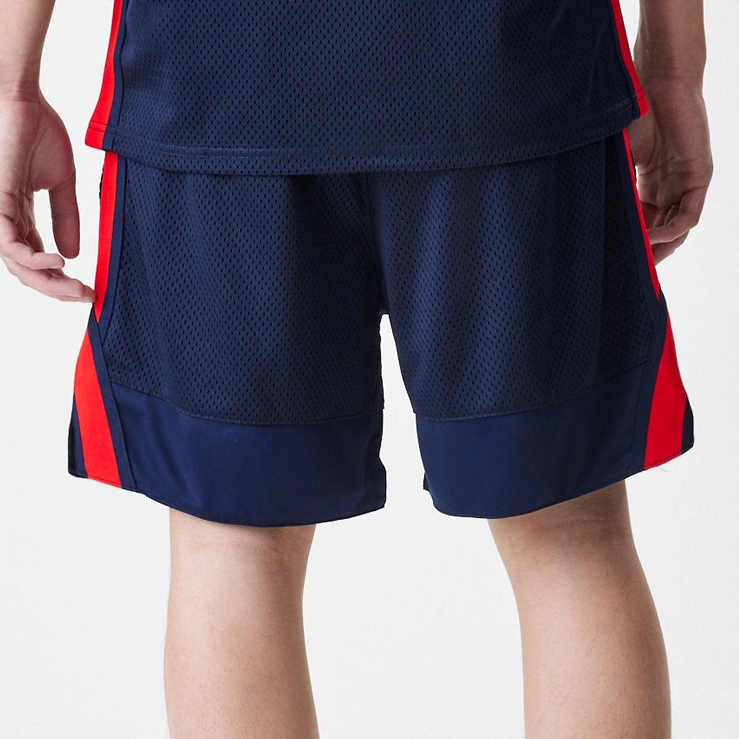 The Male model is wearing Red Bull Racing Basketball Mesh Dark Blue Shorts 7