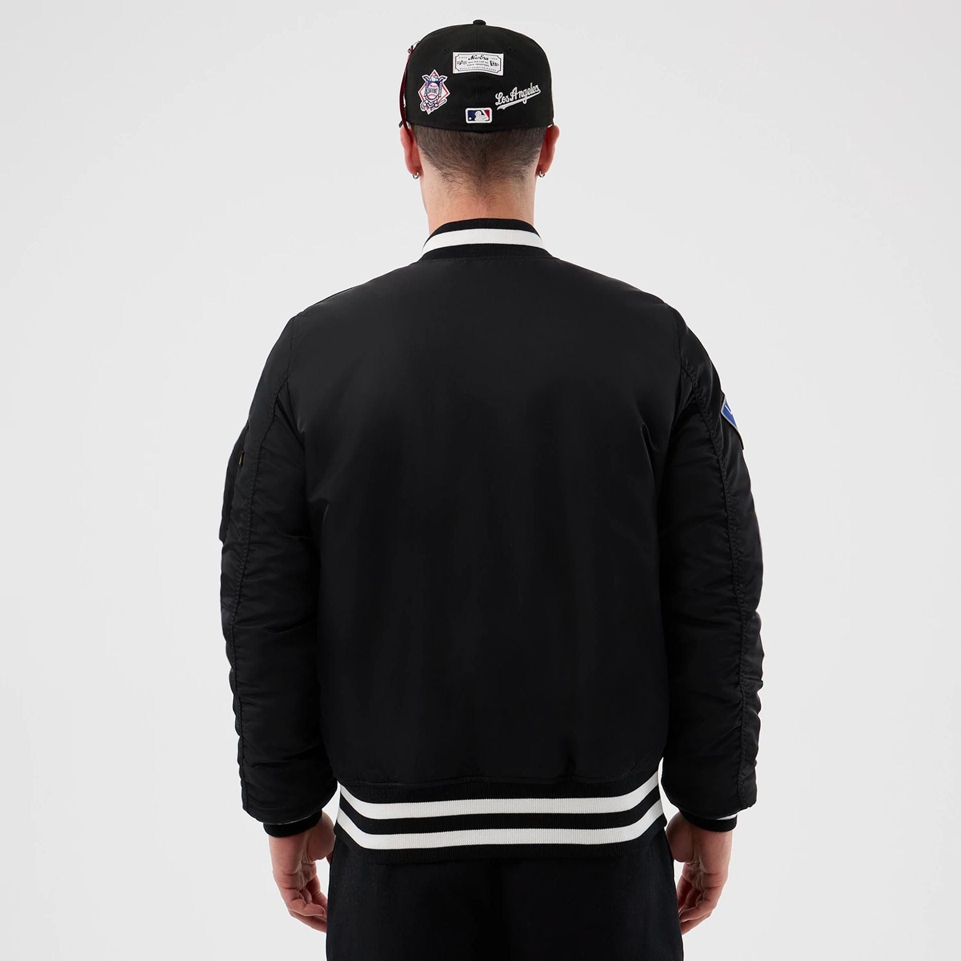 The Male model is wearing LA Dodgers MLB X Alpha Black Bomber Jacket 2