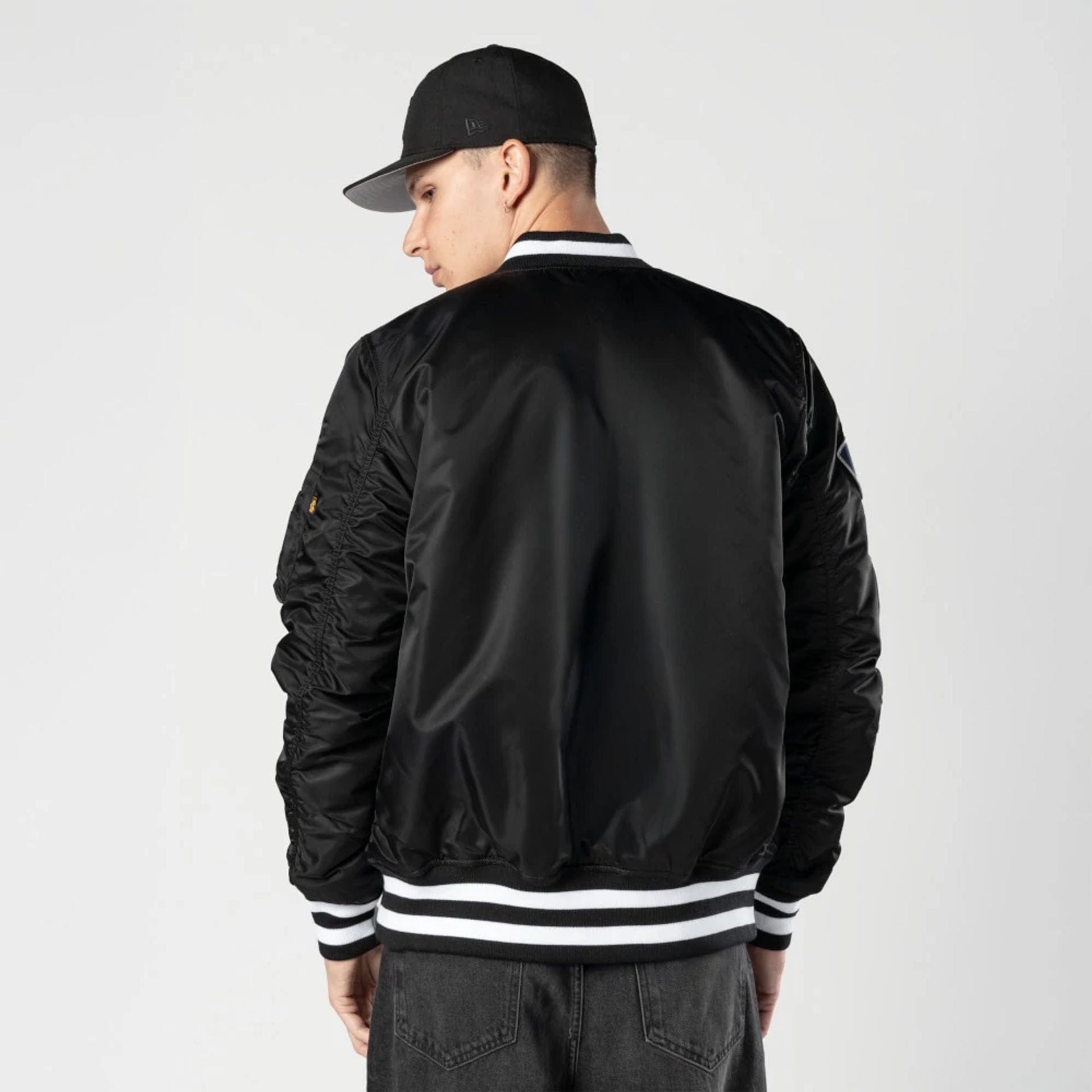 The Male model is wearing New York Yankees MLB X Alpha Black Bomber Jacket 2