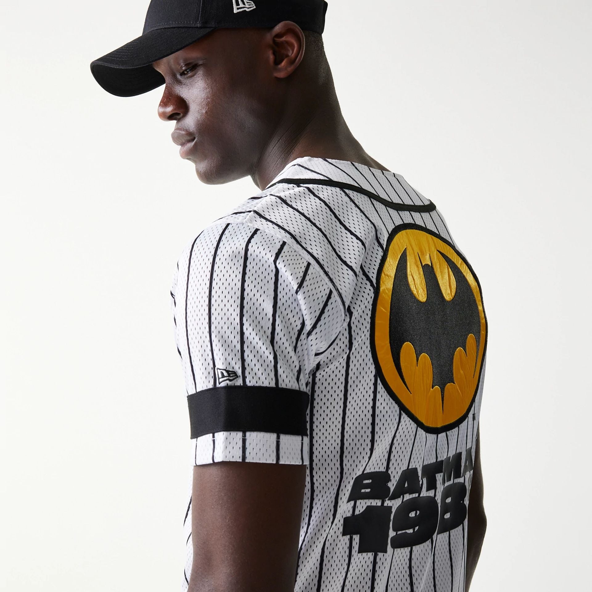 The Male model is wearing Batman Pinstripe White Jersey 5