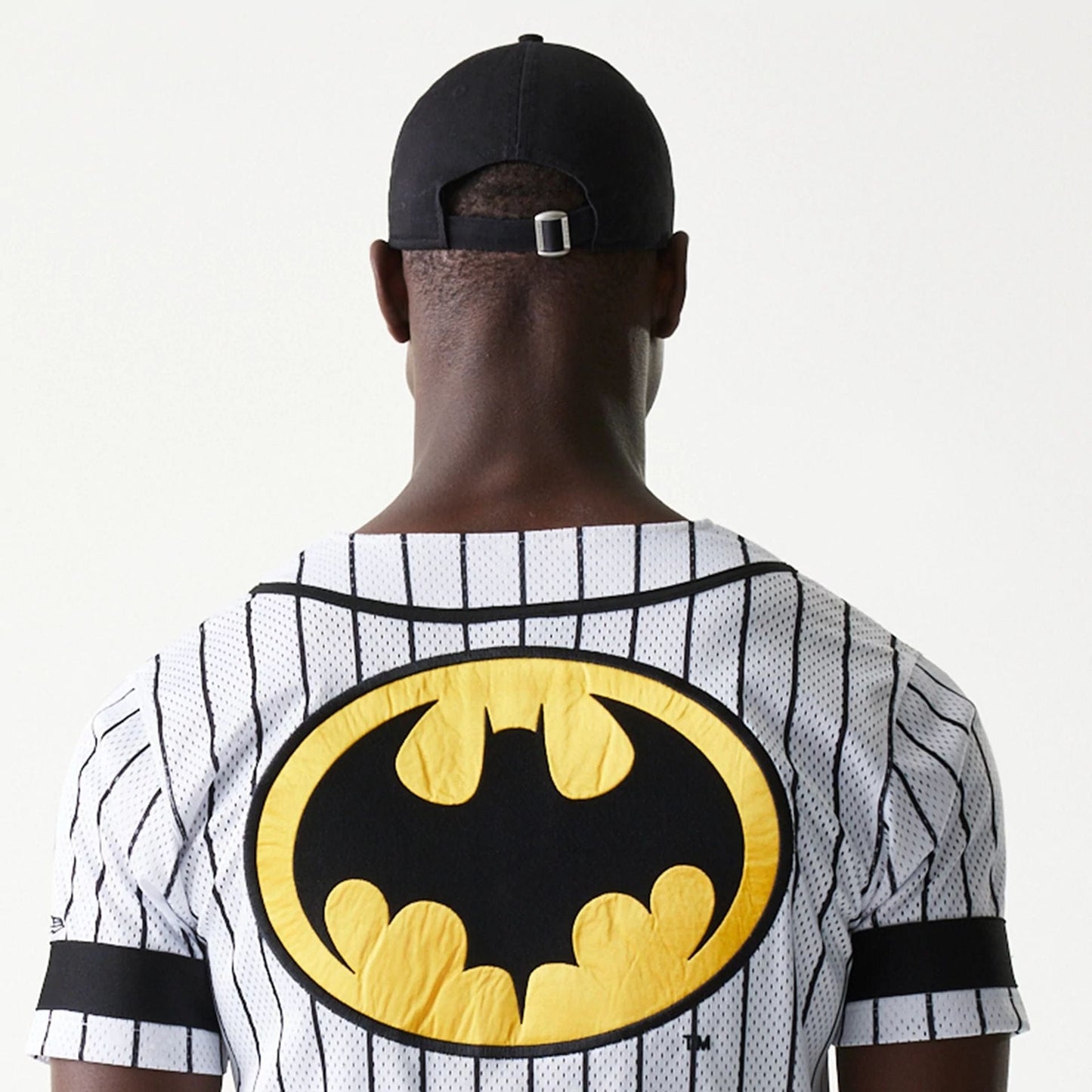 The Male model is wearing Batman Pinstripe White Jersey 6