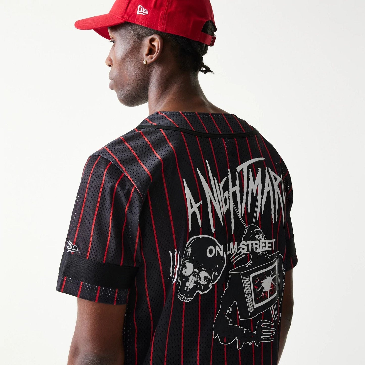 The Male model is wearing A Nightmare On Elm Street Black Jersey 6