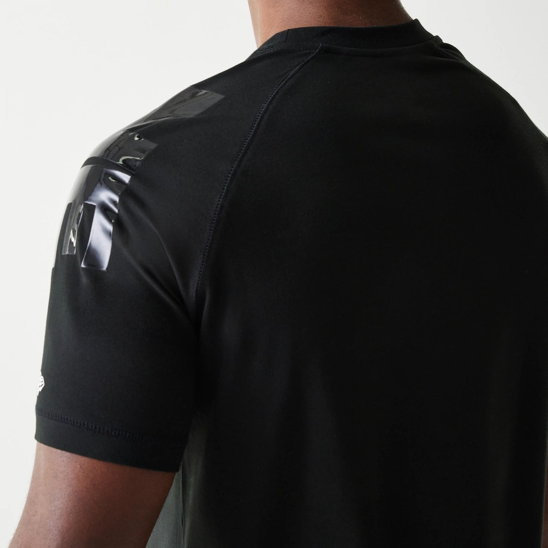 The Male model is wearing New England Patriots NFL 3RD Down Black T-Shirt 5