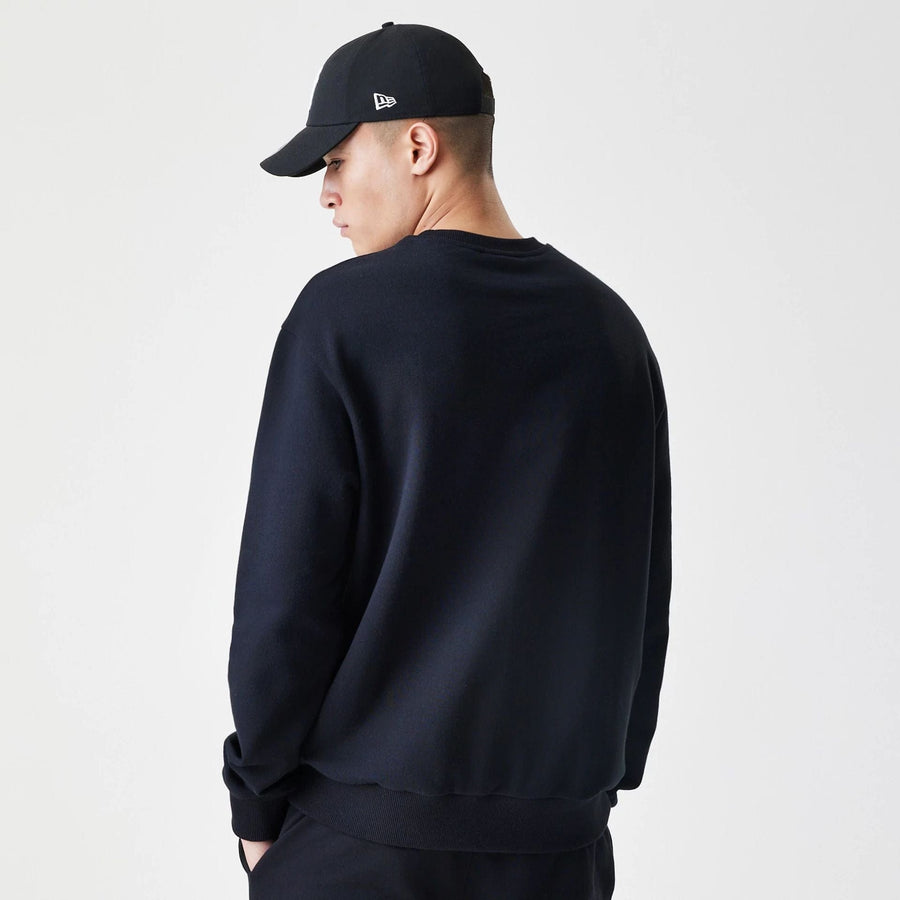 The Male model is wearing New Era Premium Essential Black Oversized Crew Neck Sweater 2