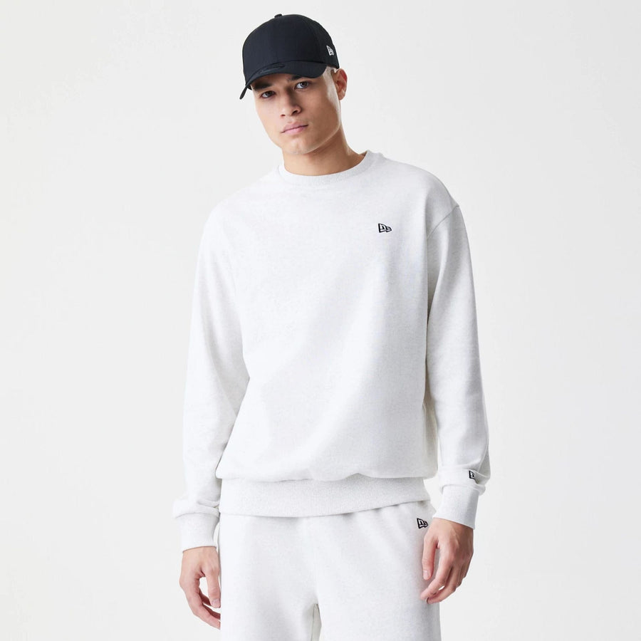 The Male model is wearing New Era Premium Essential Pastel Grey Oversized Crew Neck Sweater 1