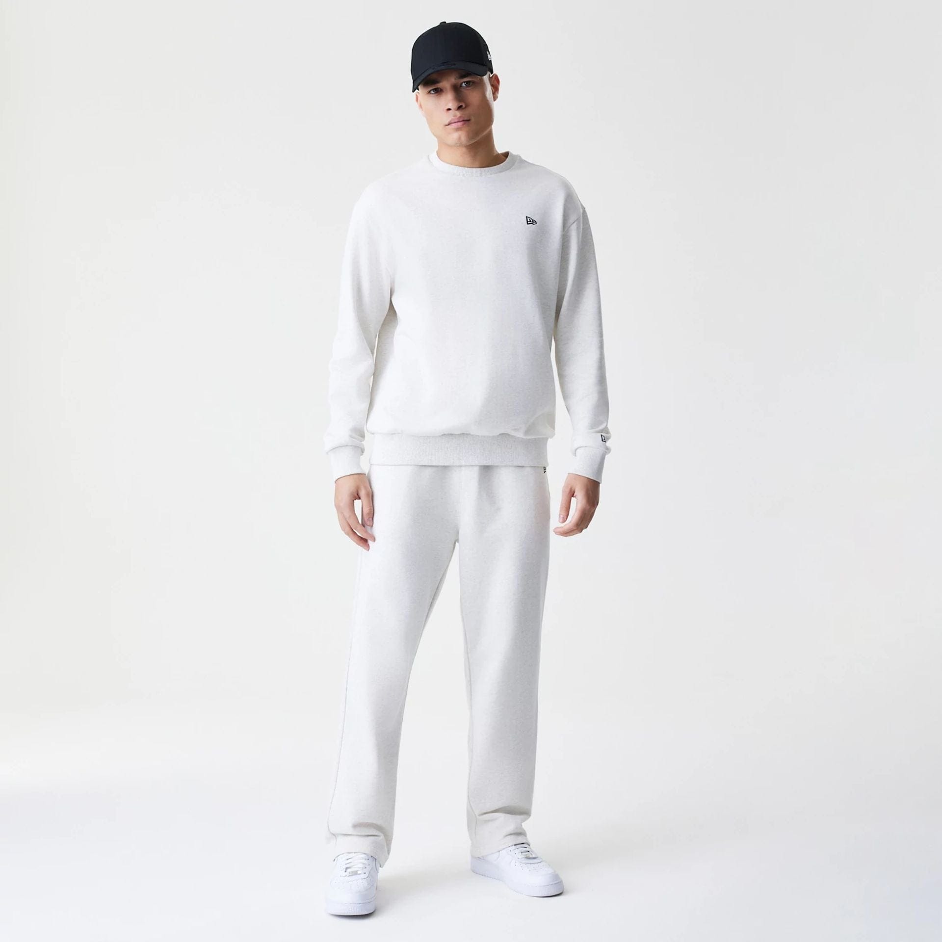 The Male model is wearing New Era Premium Essential Pastel Grey Oversized Crew Neck Sweater 8