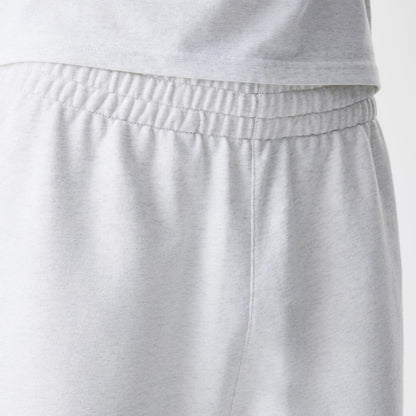 The Male model is wearing New Era Premium Essential Pastel Grey Joggers 6