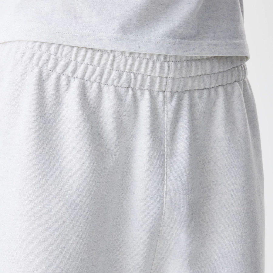 The Male model is wearing New Era Premium Essential Pastel Grey Joggers 6