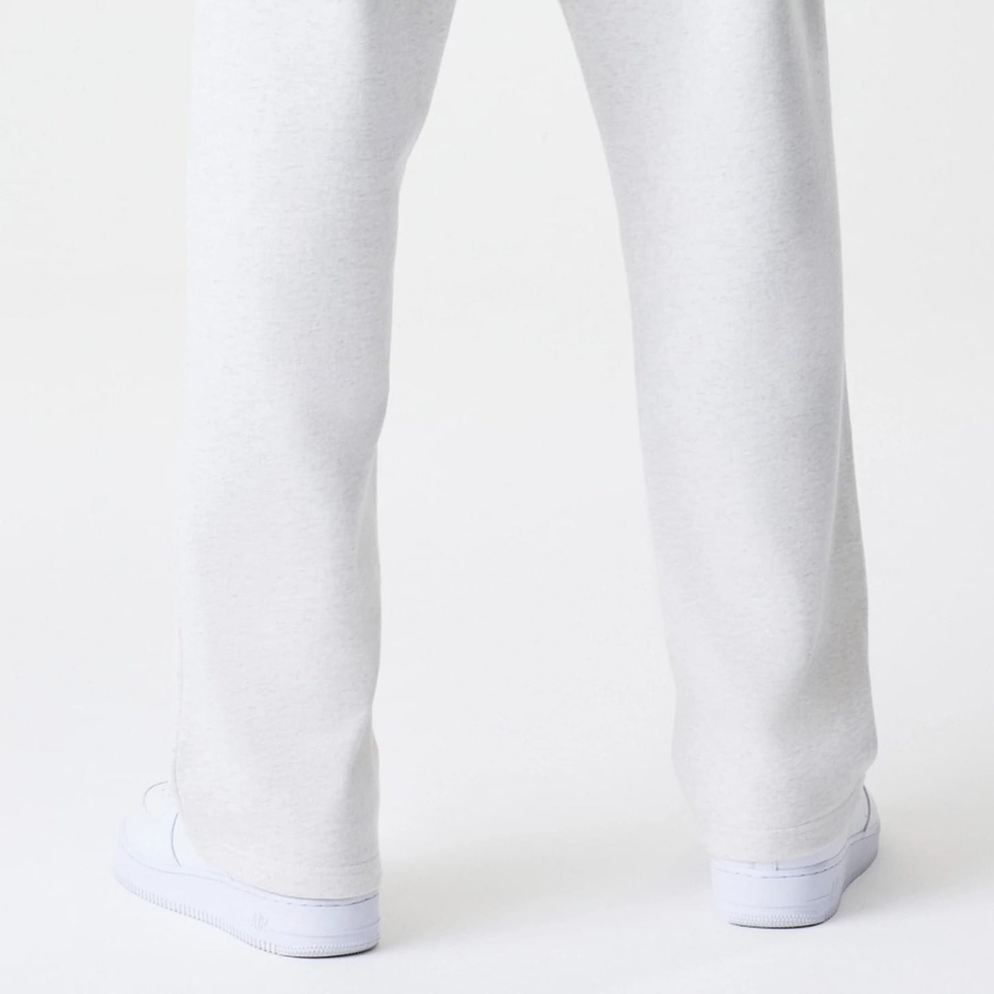 The Male model is wearing New Era Premium Essential Pastel Grey Joggers 7