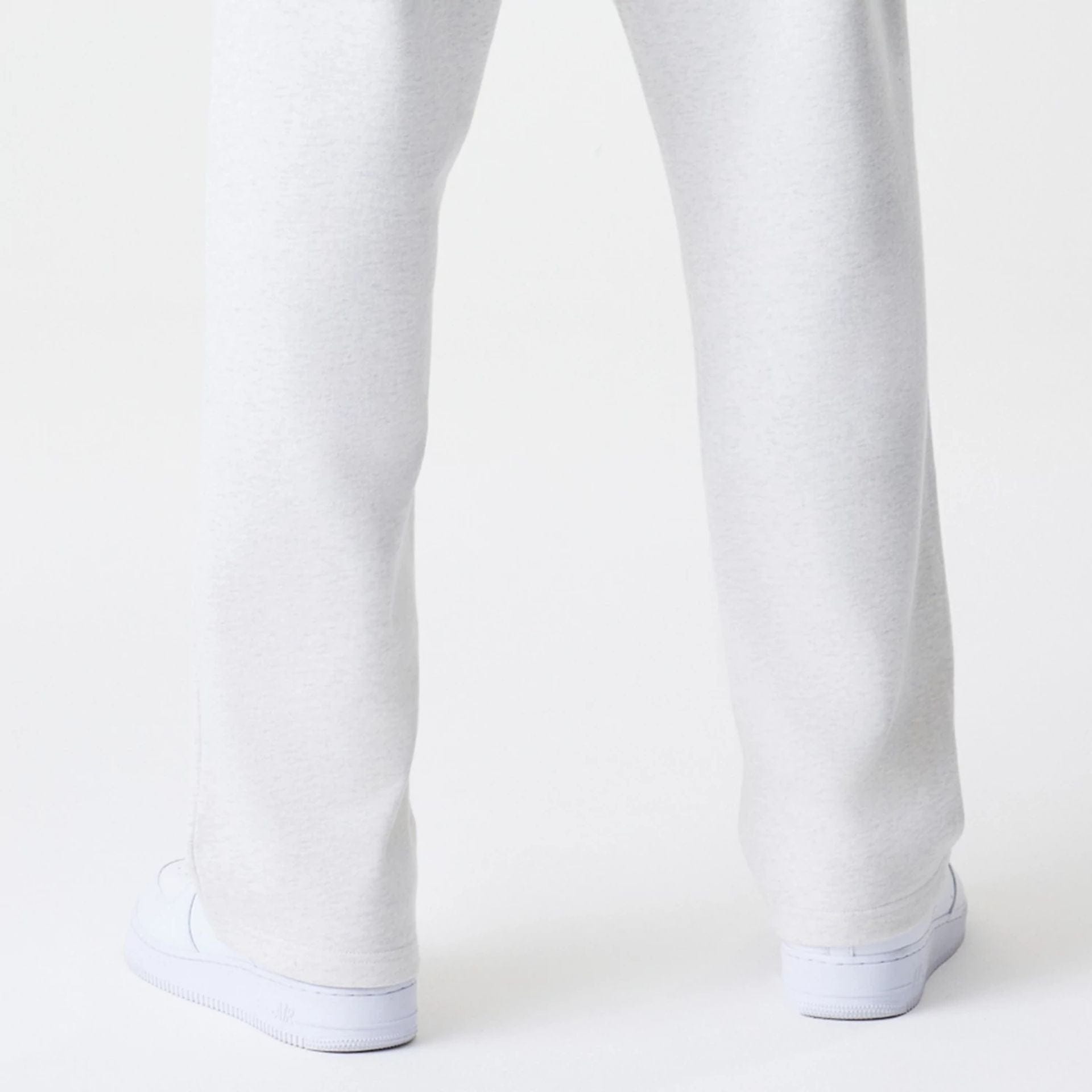 The Male model is wearing New Era Premium Essential Pastel Grey Joggers 7