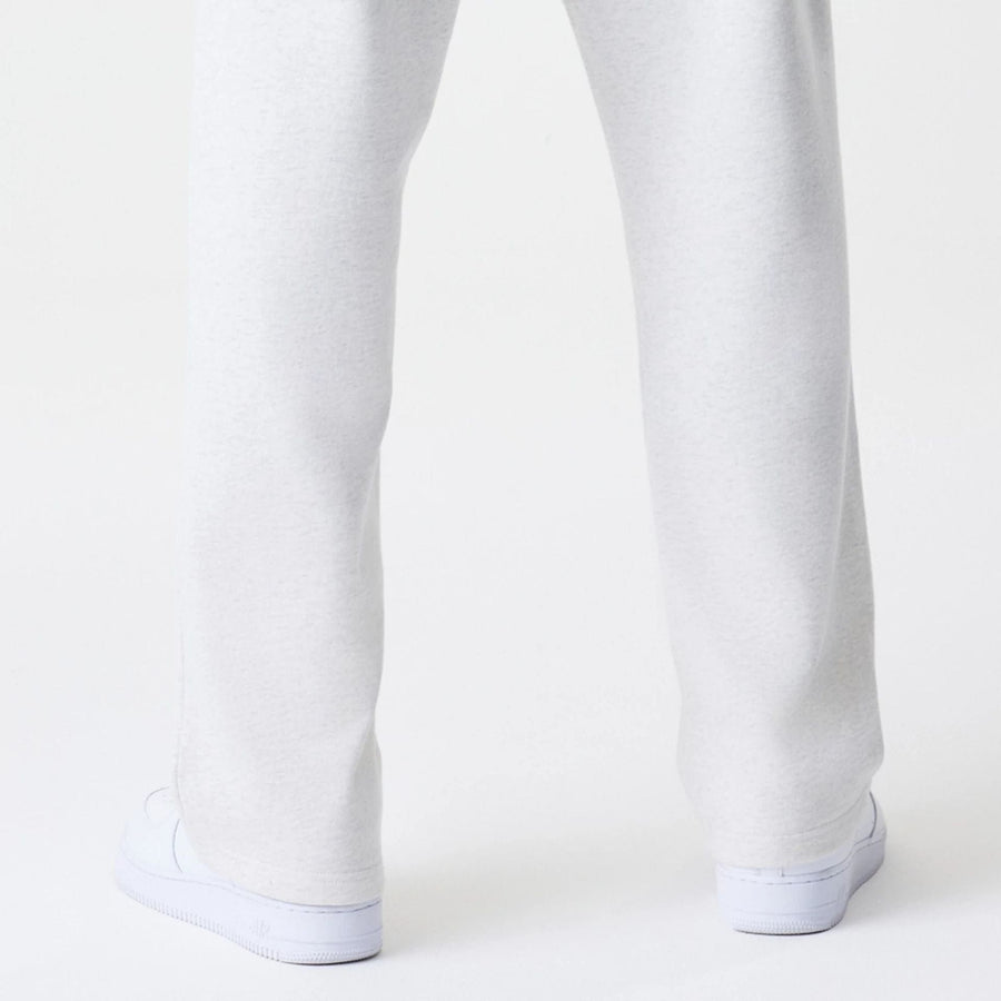 The Male model is wearing New Era Premium Essential Pastel Grey Joggers 7