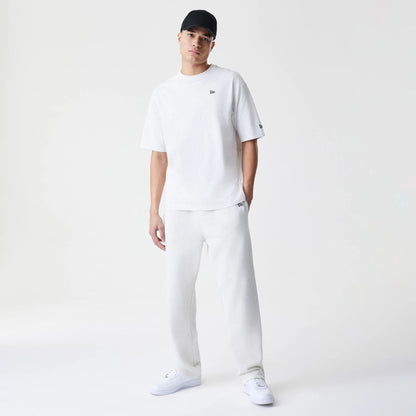 The Male model is wearing New Era Premium Essential Pastel Grey Joggers 8