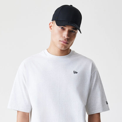 The Male model is wearing New Era Premium Essential Pastel Grey Oversized T-Shirt 6