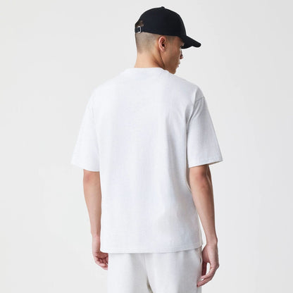 The Male model is wearing New Era Premium Essential Pastel Grey Oversized T-Shirt 2