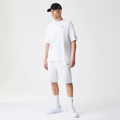 The Male model is wearing New Era Premium Essential Pastel Grey Oversized T-Shirt 8