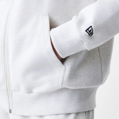 The Male model is wearing New Era Premium Essential Pastel Grey Oversized Full Zip Hoodie 5