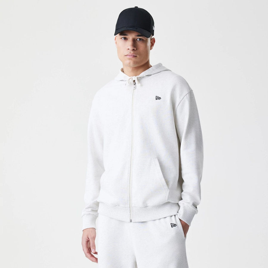 The Male model is wearing New Era Premium Essential Pastel Grey Oversized Full Zip Hoodie 1