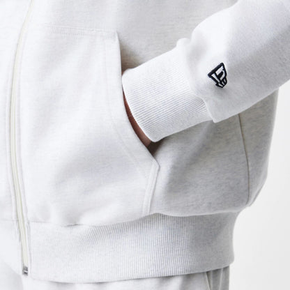 The Male model is wearing New Era Premium Essential Pastel Grey Oversized Full Zip Hoodie 5