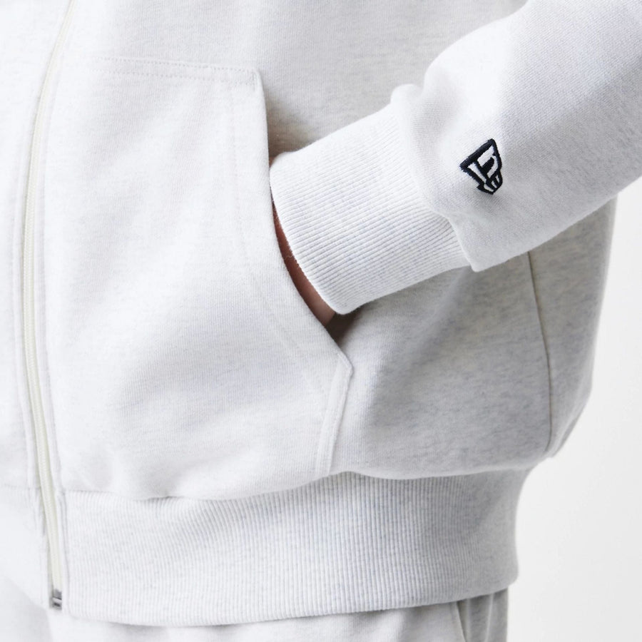 The Male model is wearing New Era Premium Essential Pastel Grey Oversized Full Zip Hoodie 5