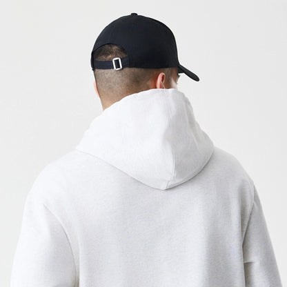 The Male model is wearing New Era Premium Essential Pastel Grey Oversized Full Zip Hoodie 7