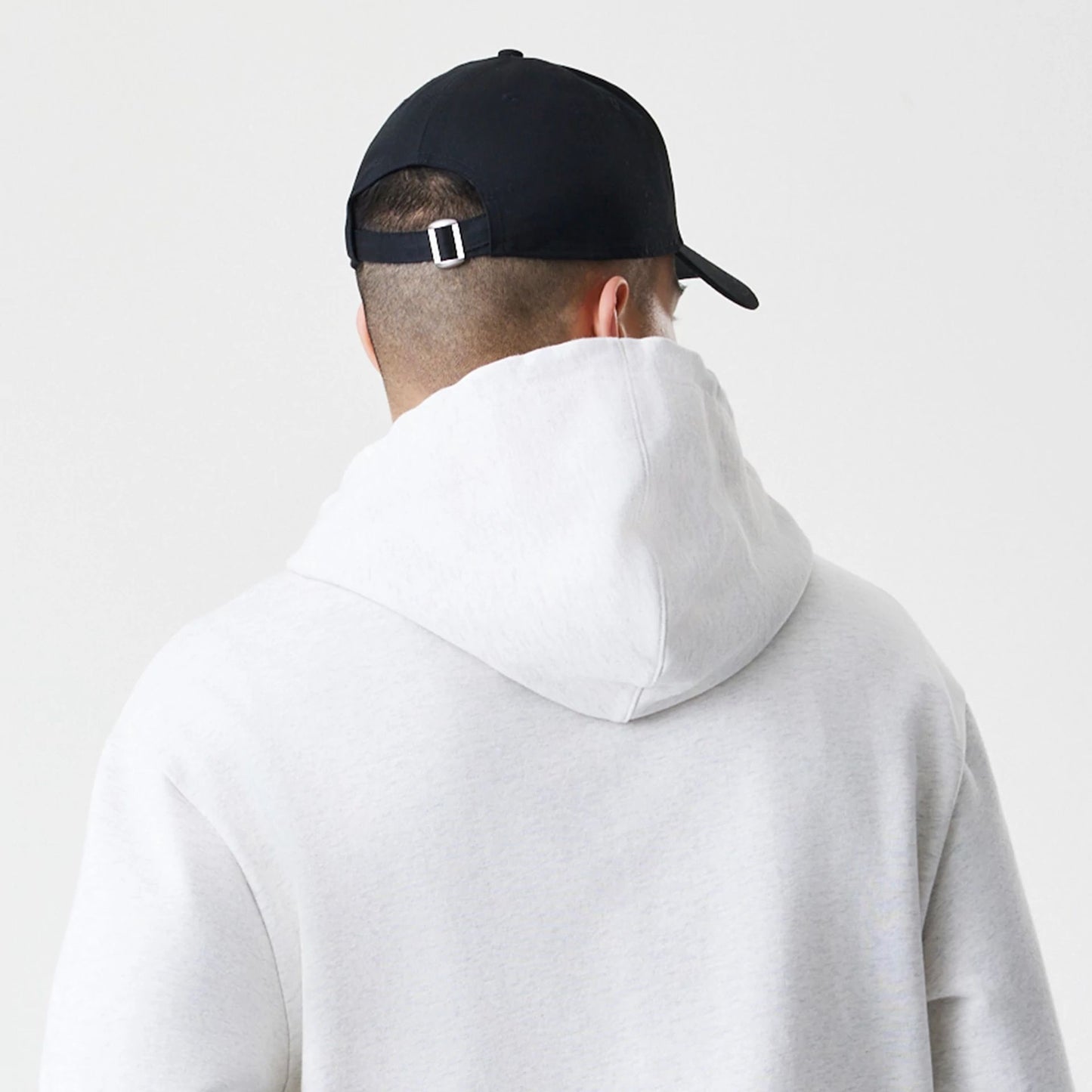 The Male model is wearing New Era Premium Essential Pastel Grey Oversized Full Zip Hoodie 7