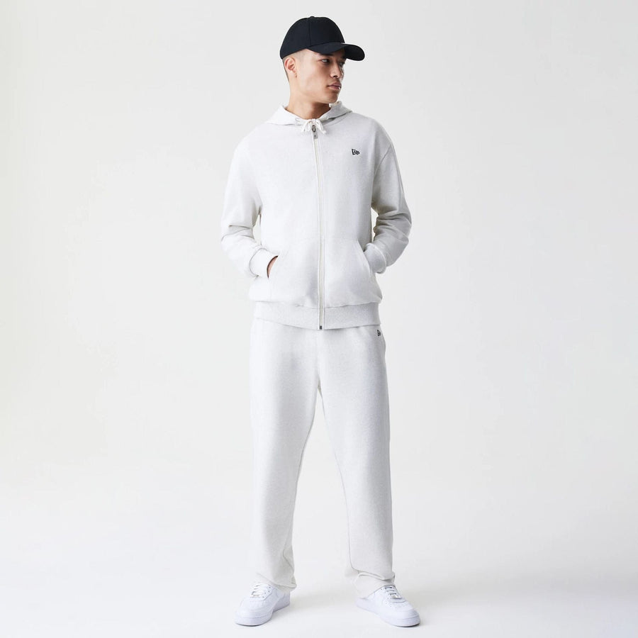 The Male model is wearing New Era Premium Essential Pastel Grey Oversized Full Zip Hoodie 8