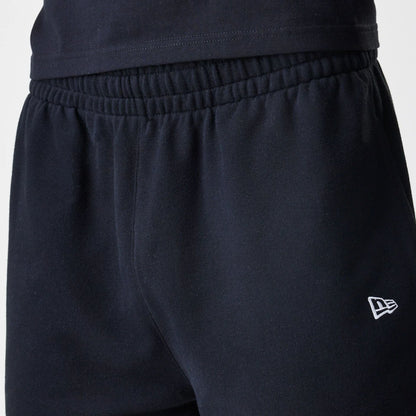 The Male model is wearing New Era Premium Essential Black Oversized Shorts 4