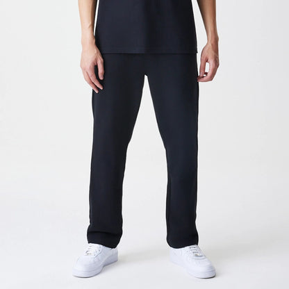 The Male model is wearing New Era Premium Essential Black Joggers 3