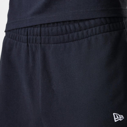 The Male model is wearing New Era Premium Essential Black Joggers 6