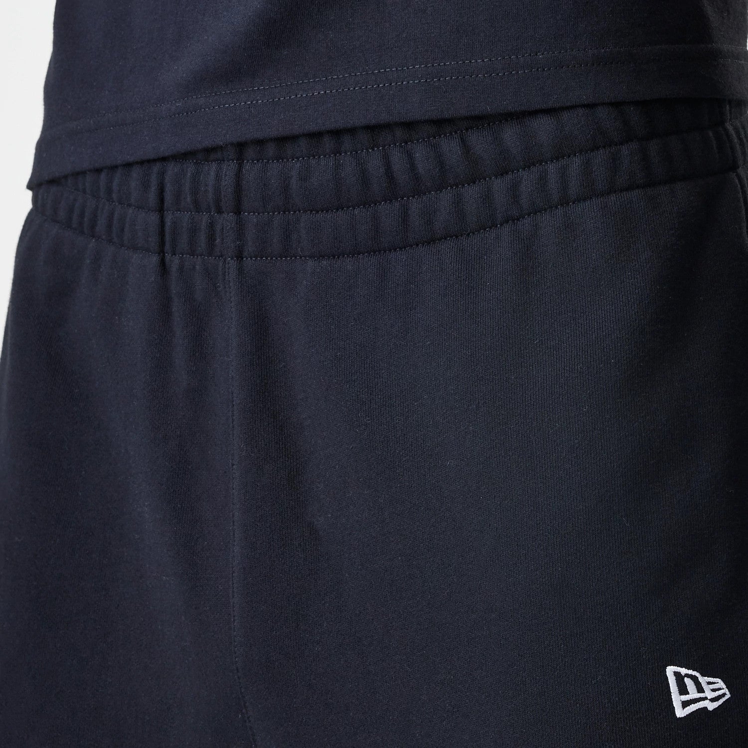 The Male model is wearing New Era Premium Essential Black Joggers 6