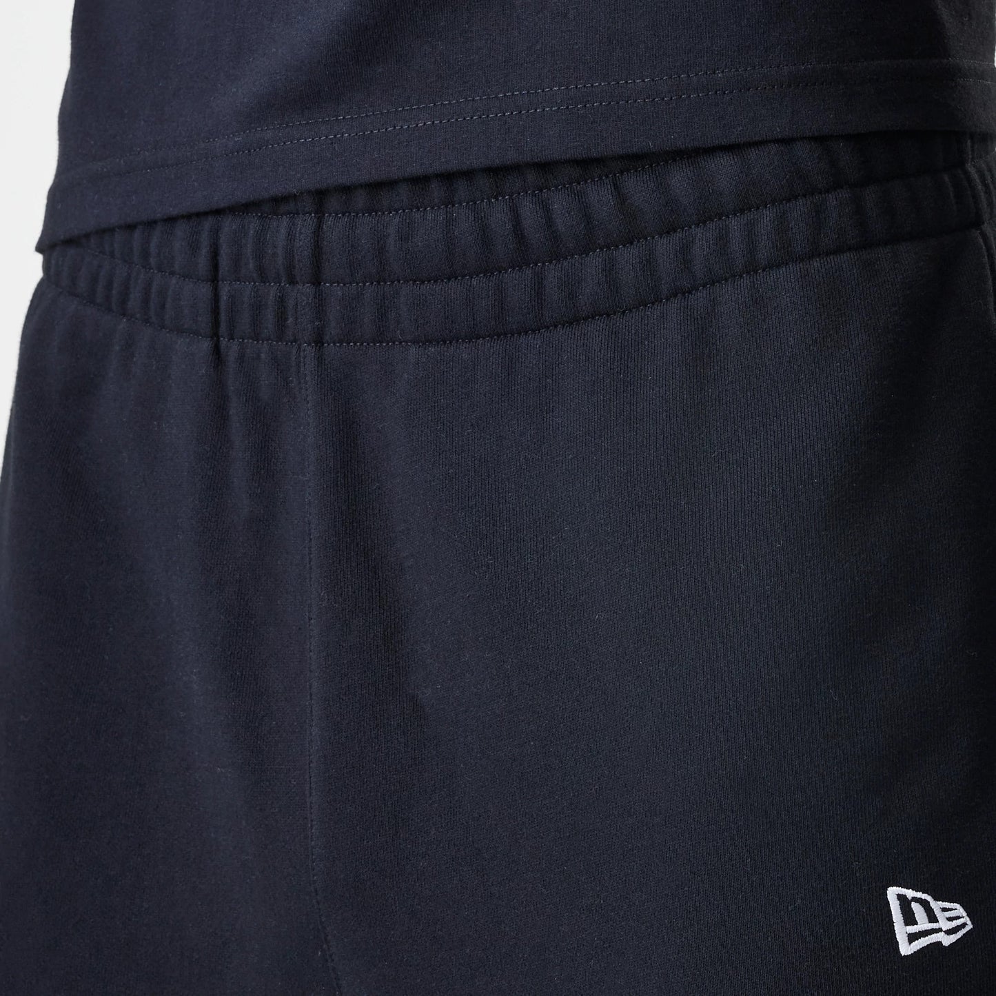 The Male model is wearing New Era Premium Essential Black Joggers 6