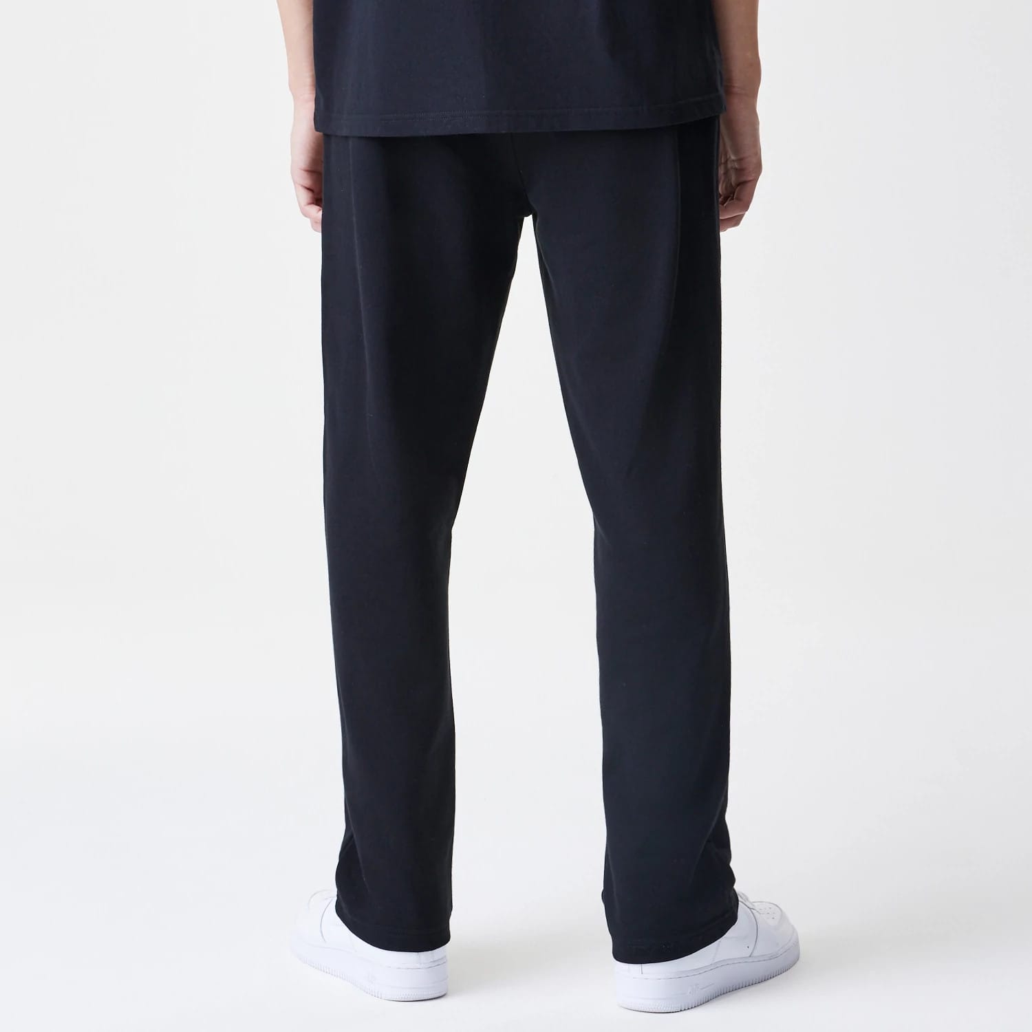The Male model is wearing New Era Premium Essential Black Joggers 2
